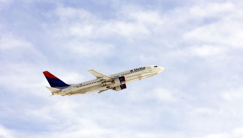 Al Hartmann | Tribune file photo
A Delta jet takes off from Salt Lake City International Airport. Airport authorities are soliciting the public's input and ideas for a new airport with construction slated to begin in 2014.