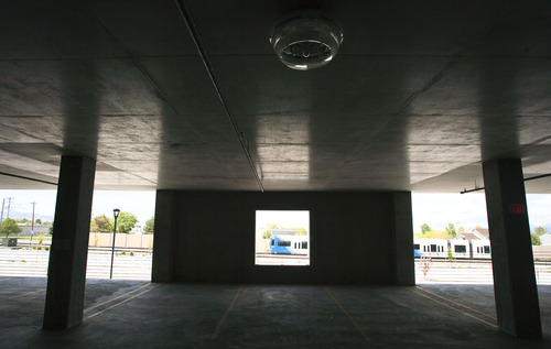 Steve Griffin | The Salt Lake Tribune

Two parking garages at the Jordan Valley TRAX station in West Jordan sit mostly empty, one partially closed and the other completely closed by UTA to save on maintenance costs. Thursday May 9, 2013.