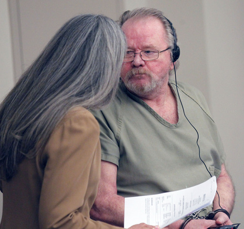Al Hartmann  |  The Salt Lake Tribune
Defense attorney McCaye Christensen confers with Dennis Lambdin in a sentencing hearing Monday May 13. Lambdin was convicted of first-degree felony murder in the 2009 slaying of his wife, Touch Lambdin, at their Cottonwood Heights home.