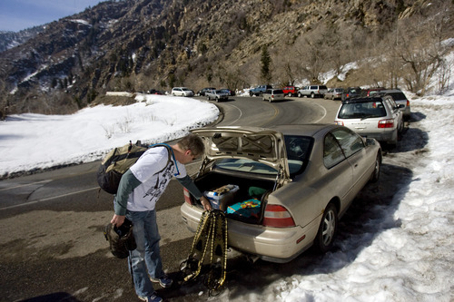 Kim Raff  |  The Salt Lake Tribune
Derek Houston puts away snowshoes in a car parked on the S-Curve at the Mill B South trailhead in Big Cottonwood Canyon on March 2, 2013. Salt Lake County studied parking in Big Cottonwood and Little Cottonwood canyons. The study recommends 17 areas where changes should be made, including prohibiting parking along the road outside of this trailhead.