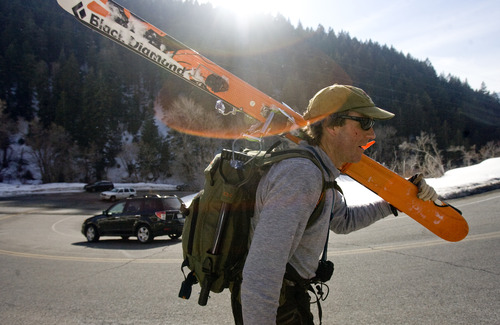 Kim Raff  |  The Salt Lake Tribune
Dave Grainger carries skies to a car parked on the S-Curve at the Mill B South trailhead in Big Cottonwood Canyon on March 2, 2013. Salt Lake County studied parking in Big Cottonwood and Little Cottonwood canyons. The study recommends 17 areas where changes should be made, including prohibiting parking along the road outside of this trailhead.