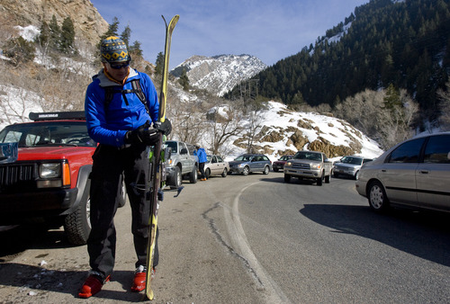 Kim Raff  |  The Salt Lake Tribune
Bob Hitchcock loads skis into a car parked on the S-Curve at the Mill B South trailhead in Big Cottonwood Canyon on March 2, 2013. Salt Lake County studied parking in Big Cottonwood and Little Cottonwood canyons. The study recommends 17 areas where changes should be made, including prohibiting parking along the road outside of this trailhead.