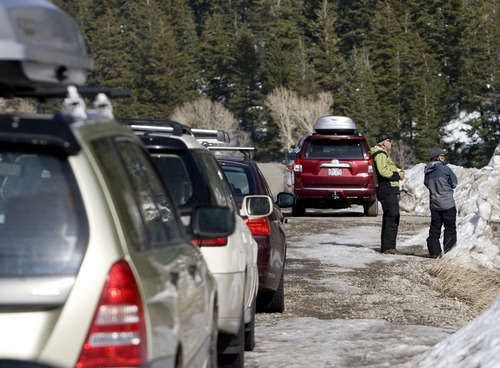 Kim Raff  |  The Salt Lake Tribune
Ben Lignugaris-Kraft (left) and Ken Hyatt talk near cars parked along the road in Big Cottonwood Canyon on March 2, 2013. Eliminating roadside parking is one recommendation of a Salt Lake County study of parking in Big Cottonwood and Little Cottonwood canyons. The study recommends 17 areas where changes should be made.