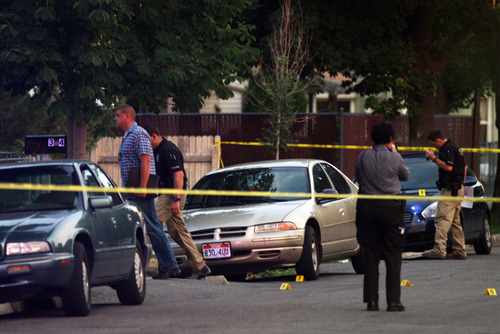 Kim Raff | The Salt Lake Tribune
Police investigate a fatal shooting on Grant Street in Salt Lake City, Utah on July 28, 2012.