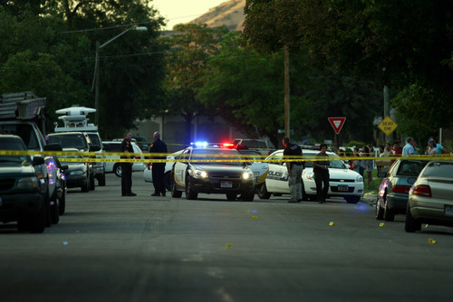 Kim Raff | The Salt Lake Tribune
Police investigate a fatal shooting on Grant Street in Salt Lake City, Utah on July 28, 2012.
