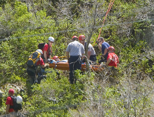 Paul Fraughton  | The Salt Lake Tribune
A  Weber County Search and Rescue Team lowers a man with an injured leg down a cliff near the summit of the North Ogden Pass road on Tuesday, May 14, 2013
