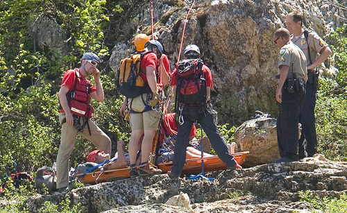 Paul Fraughton  |  The Salt Lake Tribune
A  Weber County Search and Rescue Team helps a man with an injured leg onto a stretcher prior to lowering him down a cliff near the summit of the North Ogden Pass road on Tuesday, May 14, 2013.