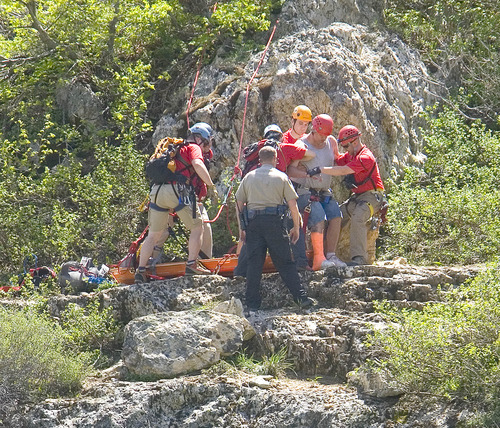 Paul Fraughton  |  The Salt Lake Tribune
A  Weber County Search and Rescue Team helps a man with an injured leg onto a stretcher prior to lowering him down a cliff near the summit of the North Ogden Pass road on Tuesday, May 14, 2013.