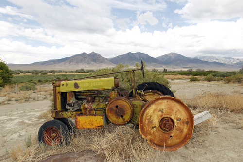 Al Hartmann  |  The Salt Lake Tribune
Abandoned tractor near the small ranch town of Trout Creek, Utah.  Deep Creek Mountains in the background.