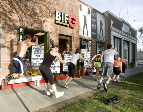 Paul Fraughton  |  The Salt Lake Tribune
Eliza James, who is adamantly opposed to the streetcar line on 1100 East in Sugar House, mixes exercising her opinions with exercising her clients as they do burpees along 1100 East in front of her Sugar House boxing gym.               
 Monday, April 29, 2013