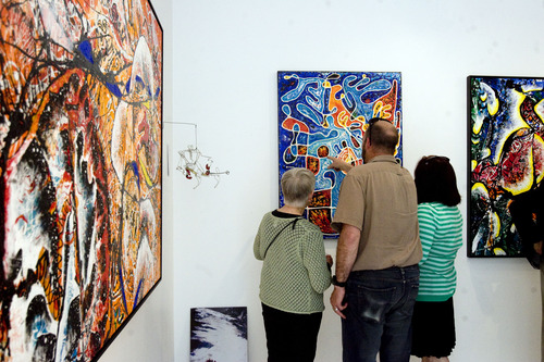 Kim Raff  |  The Salt Lake Tribune
(from left) Janet Janis, George Lukes and Becca Janis look at "Lifeline" during the "Peter Hayes Art for Life Exhibit" for former Rowland Hall biology teacher and artist Peter Hayes, who was diagnosed with a terminal lung condition, at the 15th Street Gallery in Salt Lake City on May 3, 2013.