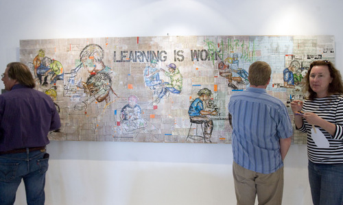 Kim Raff  |  The Salt Lake Tribune
People look at the piece "Learning is Work" during the "Peter Hayes Art for Life Exhibit" for former Rowland Hall biology teacher and artist Peter Hayes, who was diagnosed with a terminal lung condition, at the 15th Street Gallery in Salt Lake City on May 3, 2013. The piece is composed of the grading book pages that Hayes used during his 17 year teaching career.