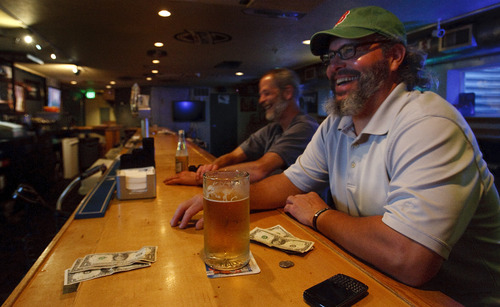 Leah Hogsten  |  The Salt Lake Tribune
Charlie McDonald, left, and Robert May watch a hockey game at the Tap Room on 2275 S. Highland Drive.
