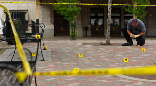 Trent Nelson  |  The Salt Lake Tribune
Police investigate at the scene of an apparent shootout at 500 West 300 South in Salt Lake City, Thursday May 16, 2013.