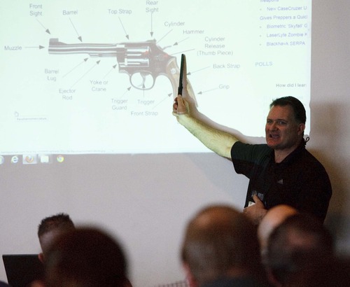 Leah Hogsten  |  Tribune file photo
Concealed firearms instructor Clark Aposhian teaches a free concealed weapons permit class for teachers and school employees last December in West Valley City's Maverik Center. Faced with a stalking injunction and a protective order, Aposhian has lost his rights to possess guns and his concealed-carry permit -- at least temporarily.