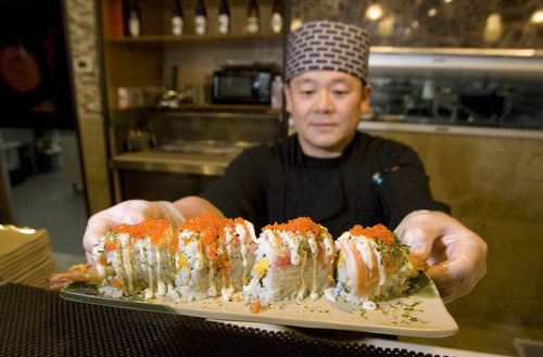 Paul Fraughton  |  The Salt Lake Tribune
Sushi chef Tony Lei offers up his Galaxy Roll, one of the sushi rolls offered at Tonys' Grill and Sushi Bar in Layton.