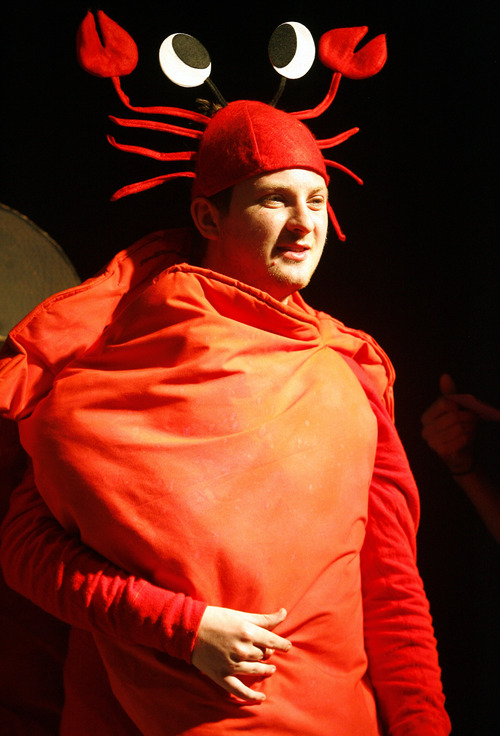 Rick Egan  | The Salt Lake Tribune 

Christian Holets as Sebastian, in theJordan Valley School, production of "The Little Mermaid" Thursday, January 25, 2013.