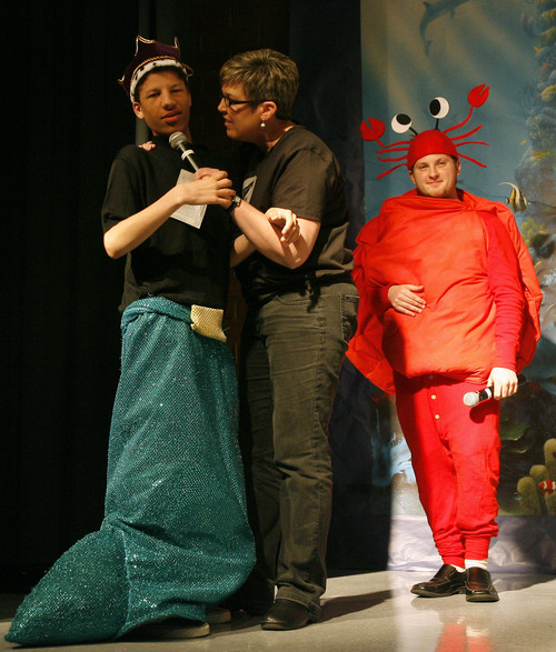 Rick Egan  | The Salt Lake Tribune 

Conner Stephenson (left) and Christian Holets (right) as Sebastian, in theJordan Valley School, production of "The Little Mermaid" Thursday, January 25, 2013.