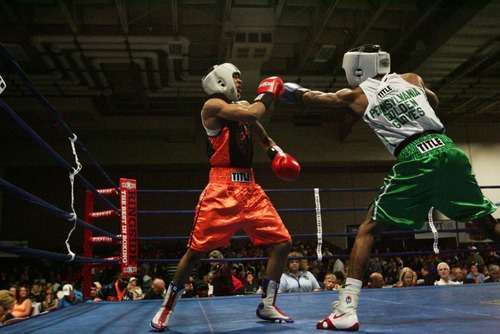 Kim Raff  |  The Salt Lake Tribune
(left) Christian Williams, of Chicago, blocks a punch by (right) Stephen Fulton Jr., from Pennsylvania, during the championship 114 lb. weight class match at Golden Gloves National Championship at the Salt Palace Convention Center in Salt Lake City on May 18, 2013. Fulton went on to win the championship.