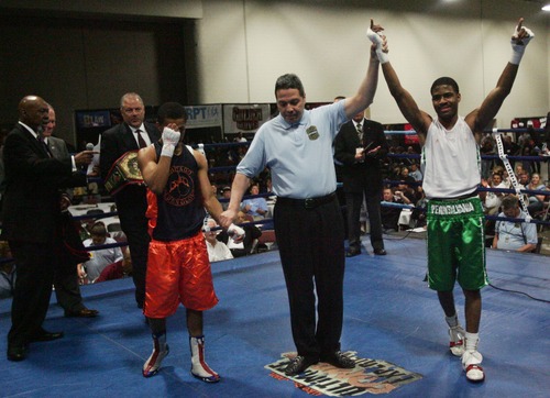 Kim Raff  |  The Salt Lake Tribune
(left) Christian Williams, of Chicago, reacts as (right) Stephen Fulton Jr., from Pennsylvania, is declared the winner of the championship 114 lb. weight class match at Golden Gloves National Championship at the Salt Palace Convention Center in Salt Lake City on May 18, 2013.