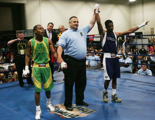Kim Raff  |  The Salt Lake Tribune
(right) Gary Antonia Russell, of Washington DC, celebrates defeating (left) Ja'Rico O'Quinn, of Detroit, during the championship 123 lb. weight class match at Golden Gloves National Championship at the Salt Palace Convention Center in Salt Lake City on May 18, 2013.