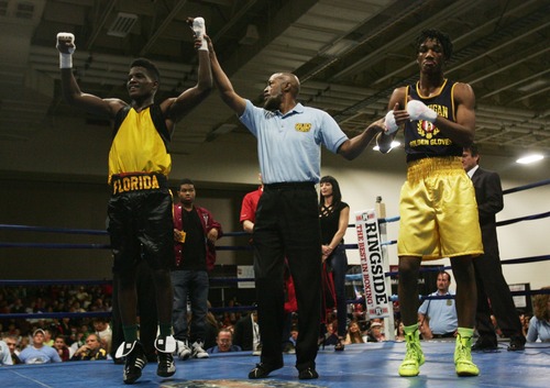 Kim Raff  |  The Salt Lake Tribune
(right) Ardreal Holmes Jr., of Michigan, reacts to being defeated by (left) Erickson Lubin, of Florida, during the championship 152 lb. weight class match at Golden Gloves National Championship at the Salt Palace Convention Center in Salt Lake City on May 18, 2013.