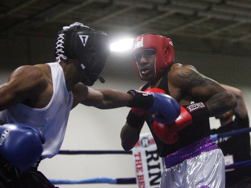 Kim Raff  |  The Salt Lake Tribune
(right) Steven Nelson dodges a punch from (left) Randy Foster, of Knoxville, during the championship 178 lb. weight class match at Golden Gloves National Championship at the Salt Palace Convention Center in Salt Lake City on May 18, 2013. Nelson went on to win the championship.