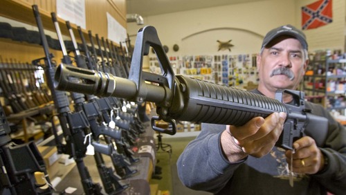 Paul Fraughton  |  Tribune file photo
Frank Baer, the owner of Patriot Arms and Gun Repair in West Jordan holds a Bushmaster AR15 223cal Rifle at his gun shop. The election years of 2008 set an all-time record for gun sales in Utah, topped by the election-year of 2012. Last December saw a huge spike in firearms purchases and sales have stayed well above-average ever since, according to state records.