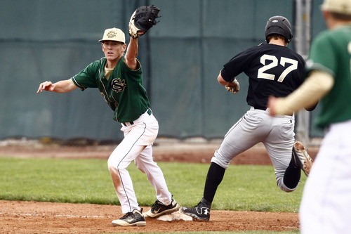 Chris Detrick  |  The Salt Lake Tribune
Snow Canyon's Chandler Day (3) gets out Desert Hills' Zac Ivie (27) at first base during the game at Brent Brown Ballpark at Utah Valley University Friday May 17, 2013. Desert Hills defeated Snow Canyon 5-4.