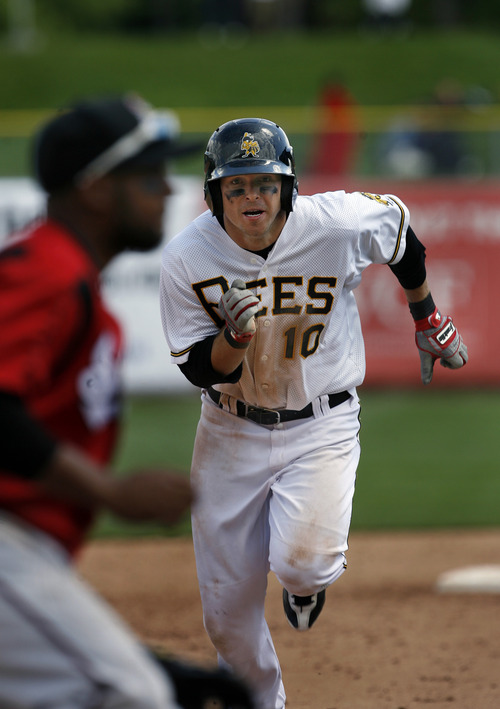 Scott Sommerdorf   |  The Salt Lake Tribune
Bees DH Trent Oeltjen steals third against the Nashville Sound, Sunday, May 19, 2013. Earlier in the inning he stole second after a single. Oeltjen is the latest in a growing line of minor and major leaguers to hail from Australia.