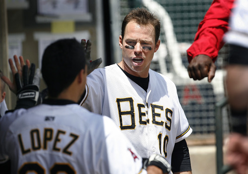 Scott Sommerdorf   |  The Salt Lake Tribune
Bees DH Trent Oeltjen congratulates Roberto Lopez team in the dugout just prior to an at bat versus the Nashville Sound, Sunday, May 19, 2013. Oeltjen is the latest in a growing line of minor and major leaguers to hail from Australia.