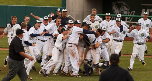 Trent Nelson  |  The Salt Lake Tribune
Snow Canyon players rush the field after defeating Desert Hills High School for the 3A boys baseball state championship in Orem Saturday May 18, 2013.