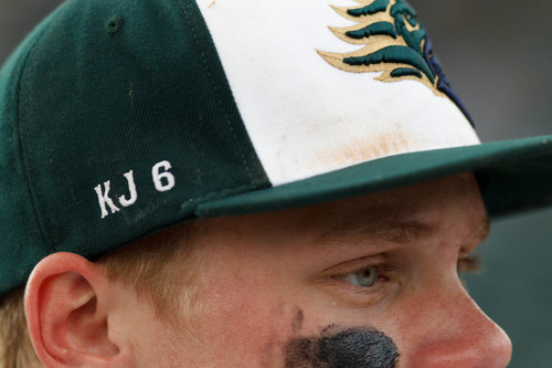 Trent Nelson  |  The Salt Lake Tribune
Snow Canyon players honored their fallen teammate Kreg "K.J." Harrison, who drowned last year. Snow Canyon defeated Desert Hills High School for the 3A boys baseball state championship in Orem Saturday May 18, 2013.
