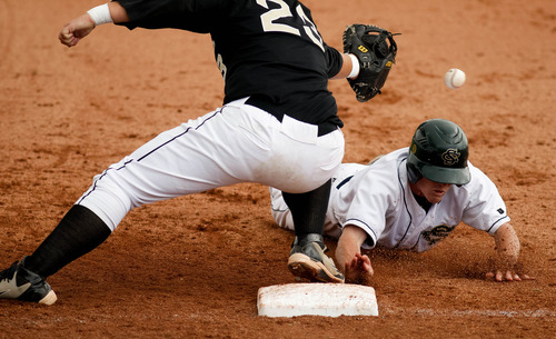 Trent Nelson  |  The Salt Lake Tribune
Snow Canyon's Chandler Day dives back into first while Desert Hills' Blake Betts reaches for the errant throw. Snow Canyon defeated Desert Hills High School for the 3A boys baseball state championship in Orem Saturday May 18, 2013.