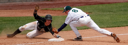 Trent Nelson  |  The Salt Lake Tribune
Snow Canyon's Mason Smith looks to tag Desert Hills' Zac Ivie at third base as Snow Canyon defeated Desert Hills High School for the 3A boys baseball state championship in Orem Saturday May 18, 2013.