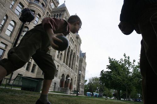 Scott Sommerdorf   |  The Salt Lake Tribune
A game of Bocce ball at one of two courts set up at the Living Traditions festival near the City and County building in downtown Salt Lake City, Friday, May 17, 2013.