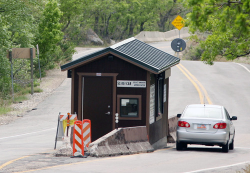 Steve Griffin  |  The Salt Lake Tribune
A car stops to pay the $3 fee in Mill Creek Canyon. A consultant's report has recommended increasing use of mass transit in the popular canyon, possibly by closing the upper canyon to vehicles and instituting a shuttle system.