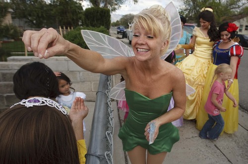 Leah Hogsten  |  The Salt Lake Tribune
Tinkerbell sprinkles pixie dust on the partygoers before their goodbyes Saturday. Magical Celebration hosted a princess birthday party for Aliveah Montoya, 4, and her two sisters Ava Montoya, 6, and Analise Lucero, 9, after hearing about the shooting death of the girls' mother, Danielle Lucero. Magical Celebration hosted a princess birthday party for Aliveah and her two sisters Ava Montoya, 6, and Analise Lucero, 9, after hearing about the shooting death of the girls' mother, Danielle Lucero. Lucero was one of three people shot and killed inside a Midvale home in February.