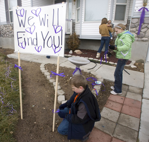 Al Hartmann  |  The Salt Lake Tribune 
Friends and family of Susan Powell put purple ribbons around her home in 2010, along with signs saying that she is loved, missed and that she will be found.