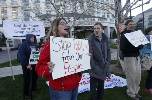 Al Hartmann  |  The Salt Lake Tribune
At the Wells Fargo meeting in late April in Salt Lake City, dozens of protesters, some carrying signs criticizing bank mortgage policies, marched peacefully. Goldman Sachs' 2012 meeting in New Jersey drew about a dozen protesters.