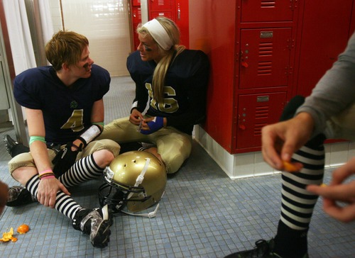 Kim Raff  |  The Salt Lake Tribune
Utah JYNX players (left) Crystal Grady and (right) Amy Broadbent talk on the locker room floor during halftime of a game against the Nevada Storm during a Women's Football Alliance game at Taylorsville High School in Taylorsville on May 18, 2013. The WFA is a full contact women's football league