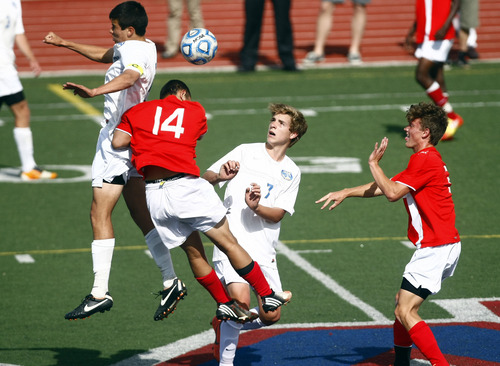 Chris Detrick  |  The Salt Lake Tribune
Orem's Daniel Corbett (11) Orem's Emil Cuello (7) East #14 (name not on roster) and East's Thomas Young (3) go for the ball during the game at Woods Cross High School Tuesday May 21, 2013. Orem won the game 1-0.