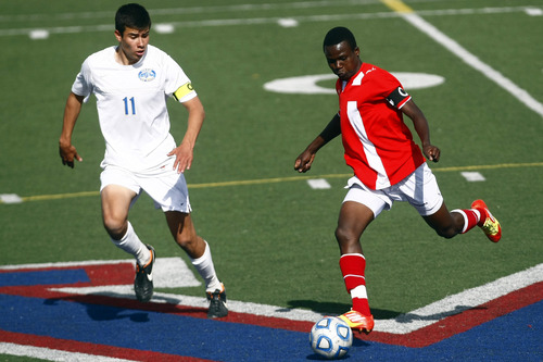 Chris Detrick  |  The Salt Lake Tribune
Orem's Daniel Corbett (11) and East's Abdi Iftin (10) go for the ball during the game at Woods Cross High School Tuesday May 21, 2013. Orem won the game 1-0.