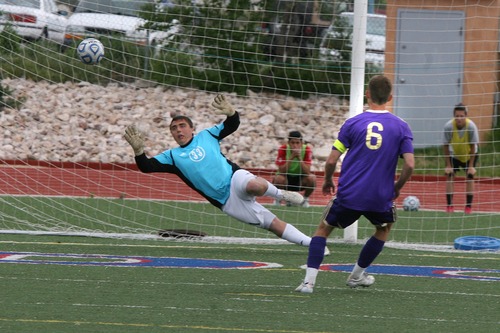Paul Fraughton  |   Salt Lake Tribune
 Brighton goal keeper Braeden Hickey guessed right on the direction, but still could not get to the ball kicked by Lehi's #6  giving Lehi the win in their semifinal match at Woods Cross High.                       
 Tuesday, May 21, 2013