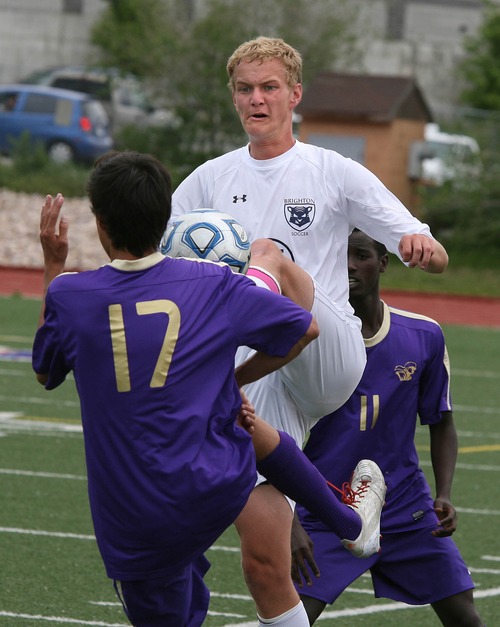 Paul Fraughton  |   Salt Lake Tribune
   Brighton's Ben Perkins tries to maintain control of the ball as he is surrounded by Lehi's Cooper Rios, #17 and Bosco Muhire.                         
 Tuesday, May 21, 2013