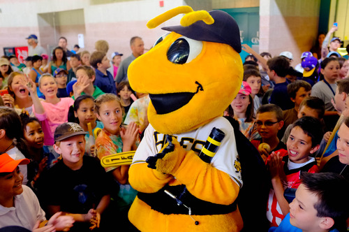 Trent Nelson  |  The Salt Lake Tribune
Schoolchildren surround Bumble, the Salt Lake Bees mascot, as the Bees take on the Memphis Redbirds, AAA baseball in Salt Lake City Tuesday May 21, 2013.