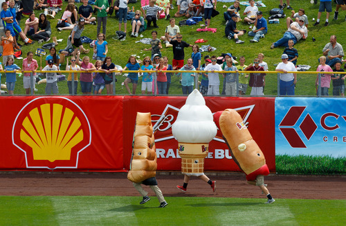 Trent Nelson  |  The Salt Lake Tribune
Schoolchildren watch a race between a slice of pizza, an ice cream cone and a hot dog as the Salt Lake Bees take on the Memphis Redbirds, AAA baseball in Salt Lake City Tuesday May 21, 2013.
