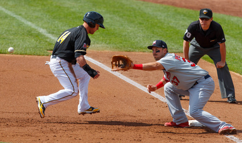 Trent Nelson  |  The Salt Lake Tribune
Salt Lake's Kole Calhoun runs safely back to first base with Memphis's Brock Peterson about to make the catch as the Salt Lake Bees take on the Memphis Redbirds, AAA baseball in Salt Lake City Tuesday May 21, 2013.