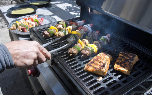 Paul Fraughton  |  The Salt Lake Tribune
Kebobs and salmon on the grill.