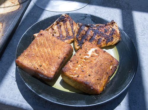 Paul Fraughton  |  The Salt Lake Tribune
Cedar planked salmon and grilled salmon are ready to be served.